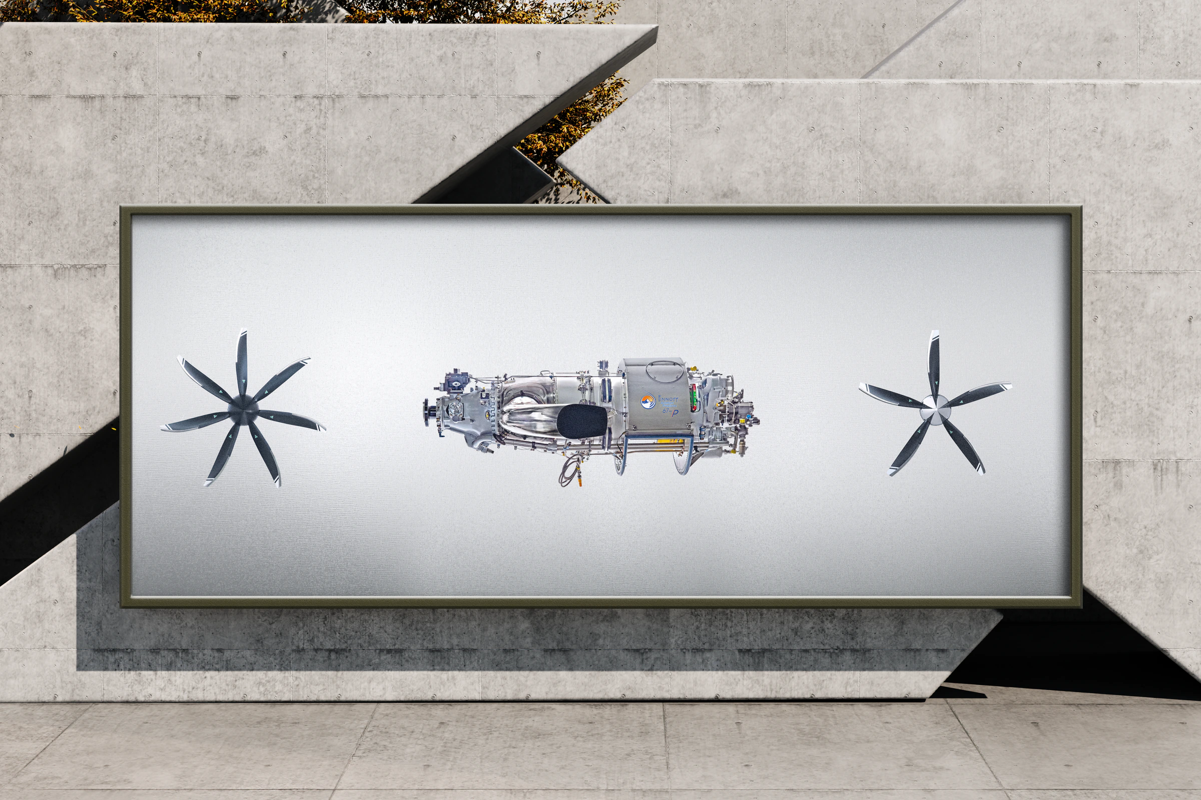 A billboard on a concrete wall showing the MT seven-blade propeller, the PT6A-67P engine and the MT five-blade propeller on a gray gradient